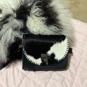 Elegant Black and White Cowhide Clutch